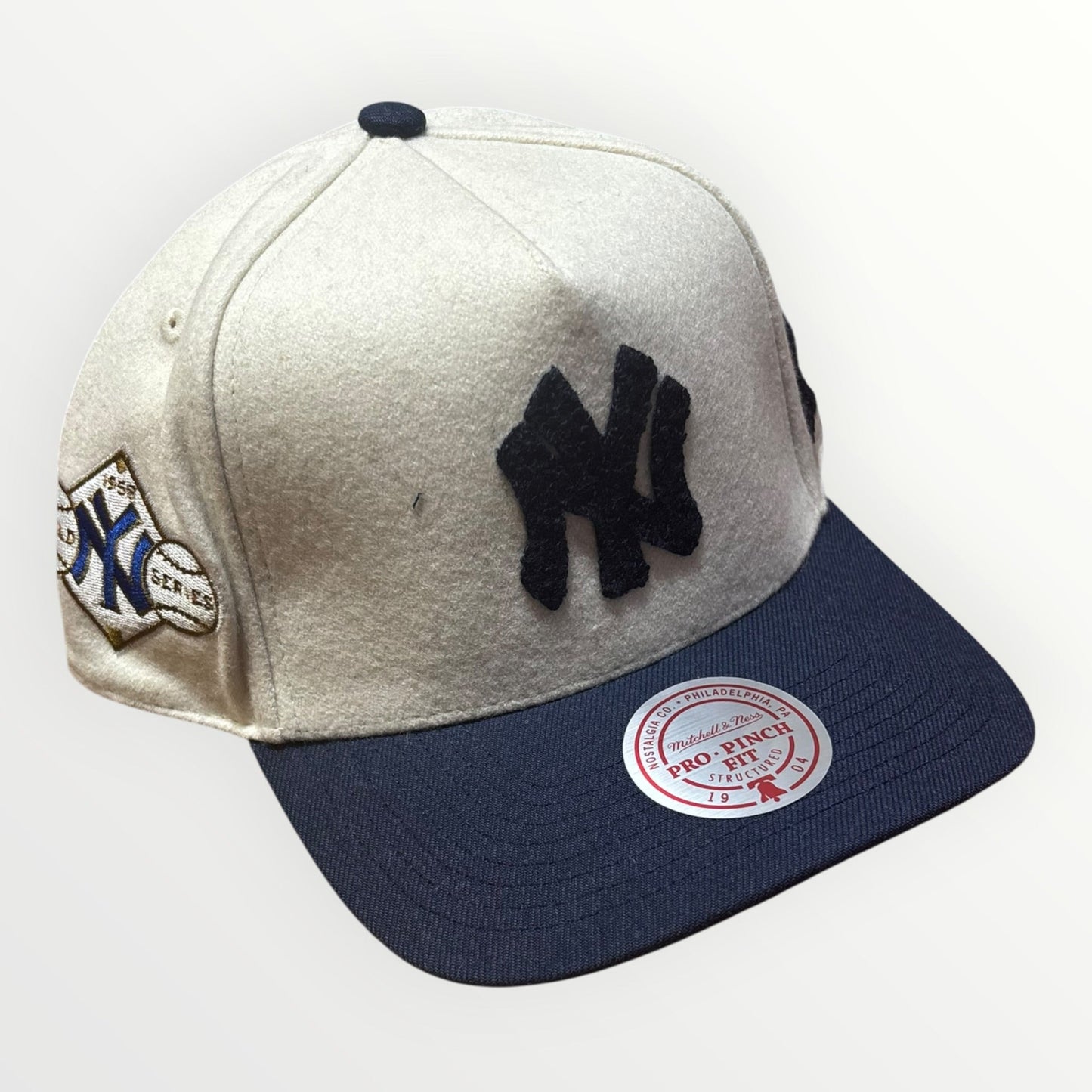 Mitchell & Ness New York Yankees Cream Team Pro Snapback from On Time Fashions – Snapback Hat by Mitchell & Ness, Birmingham AL’s 1 fashion store and premier destination for streetwear, suits, kids fashion, and big & tall