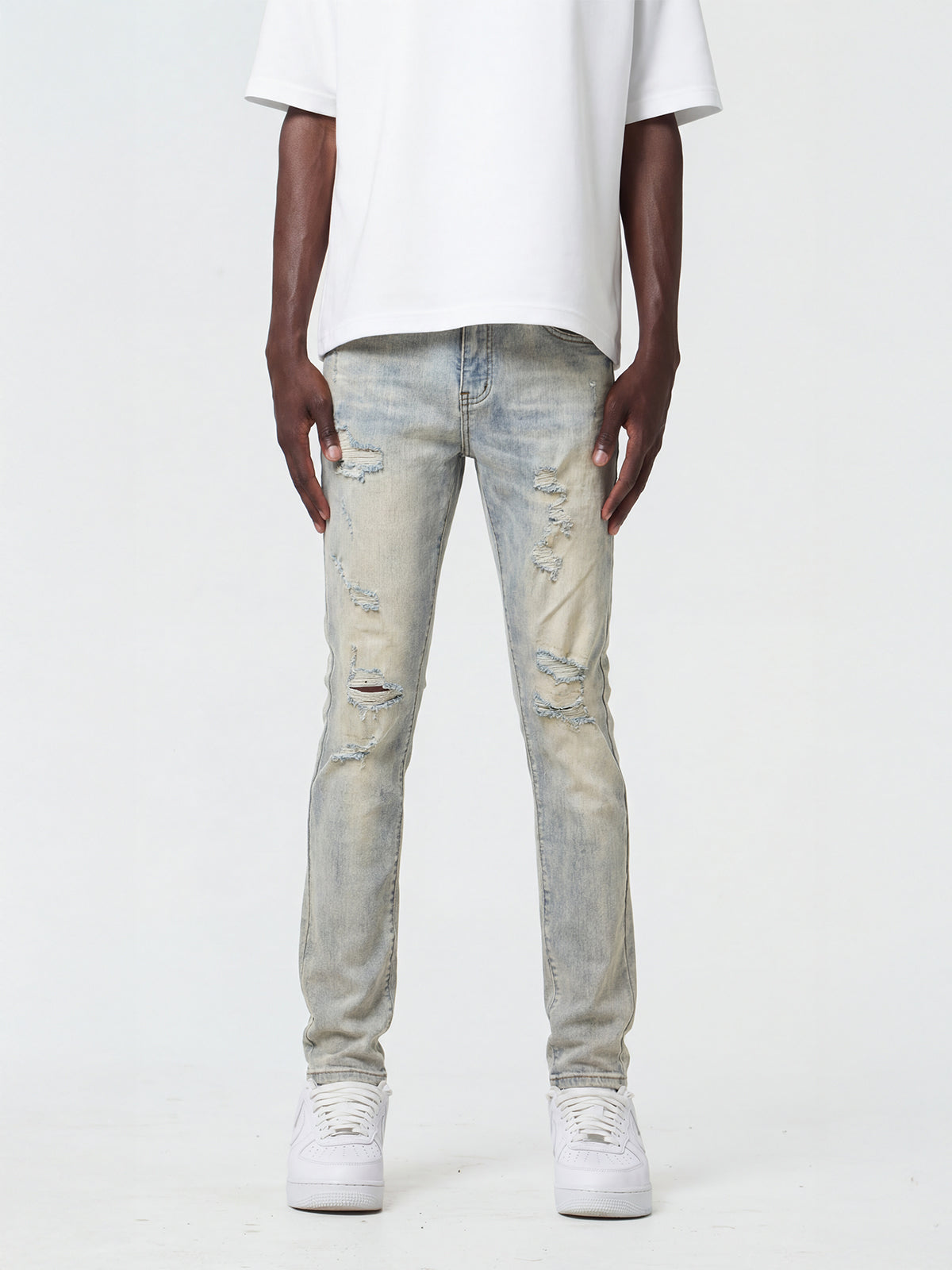 Waimea M8727 slim fit jeans in Bleach Wash with distressed rip-and-repair details, front view on model