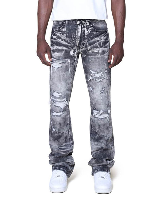 Person wearing distressed gray jeans on a white background