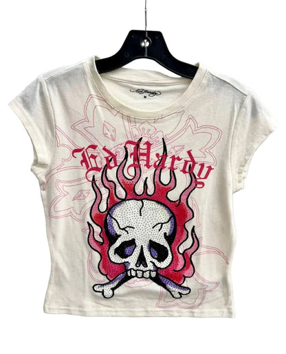 White t-shirt with skull and crossbones design on a hanger against a white background