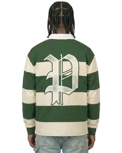 Person wearing a green and white striped rugby jersey with a logo on the back against a plain background