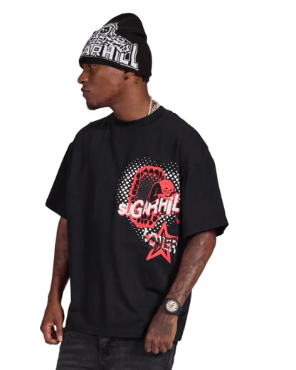 Person wearing a black t-shirt with red graphic design and a beanie on a white background