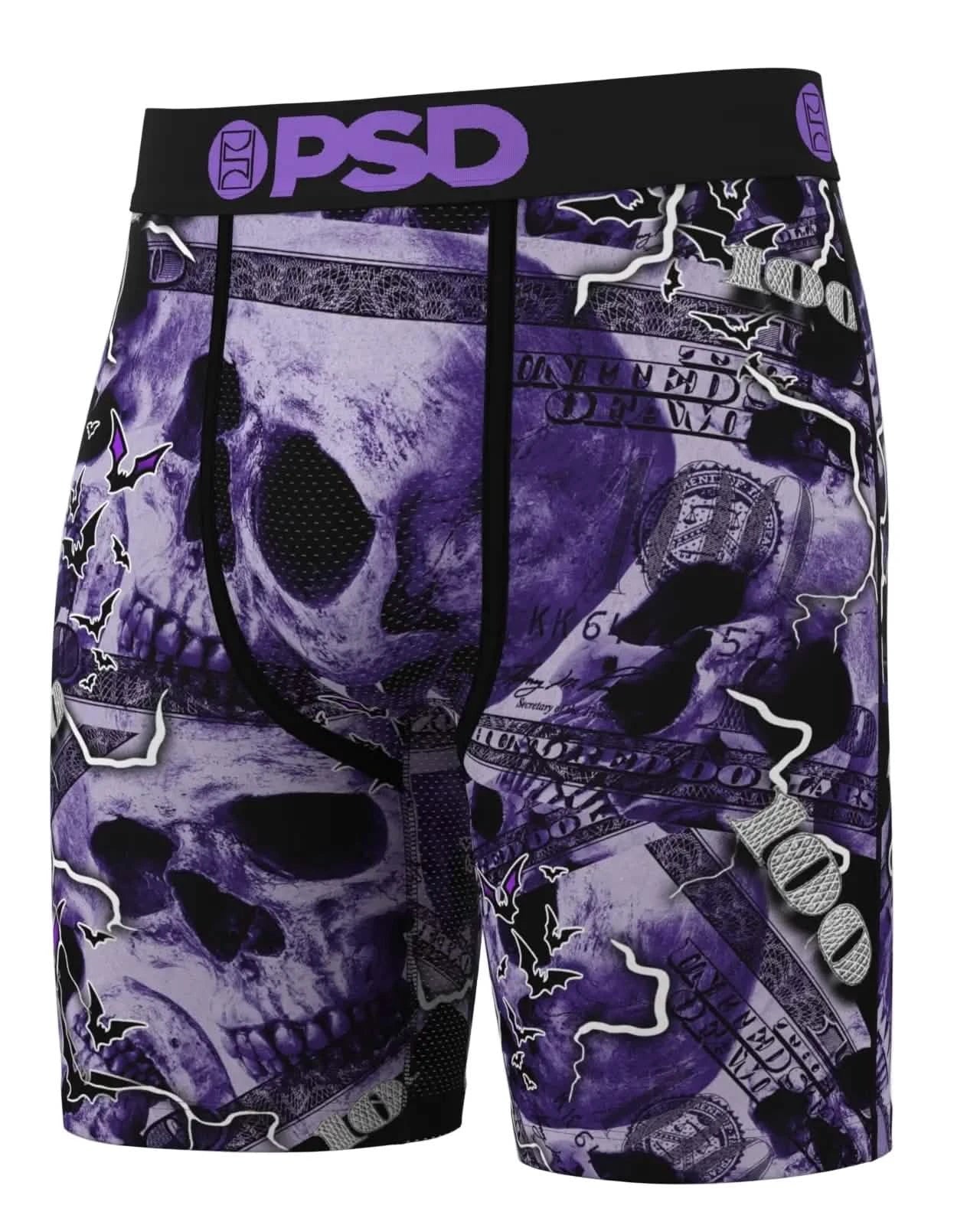 Purple and black shorts with skull and money design, featuring the brand 'PSD'.