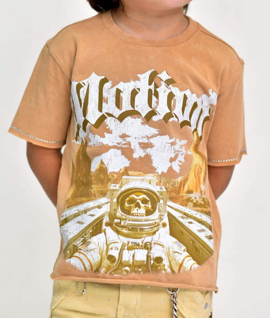 Child wearing a tan t-shirt with a graphic design and text on a plain background