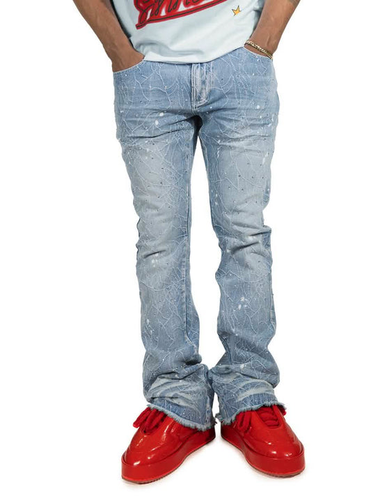 Person wearing light blue jeans and red shoes on a white background