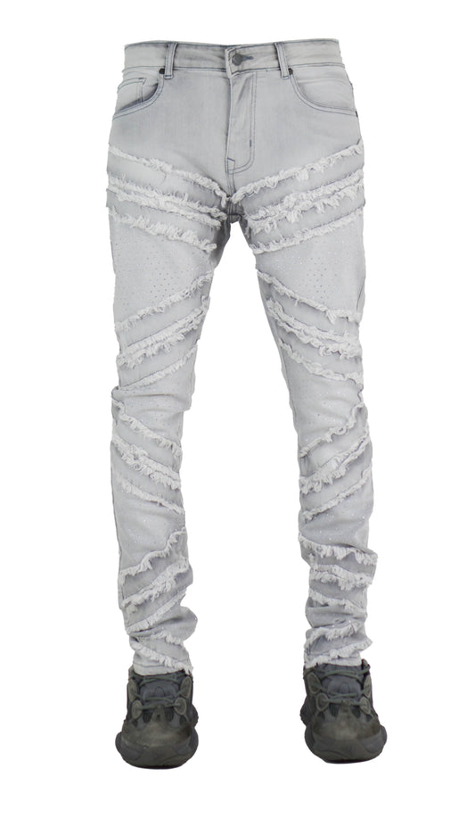 Light grey distressed jeans on a white background