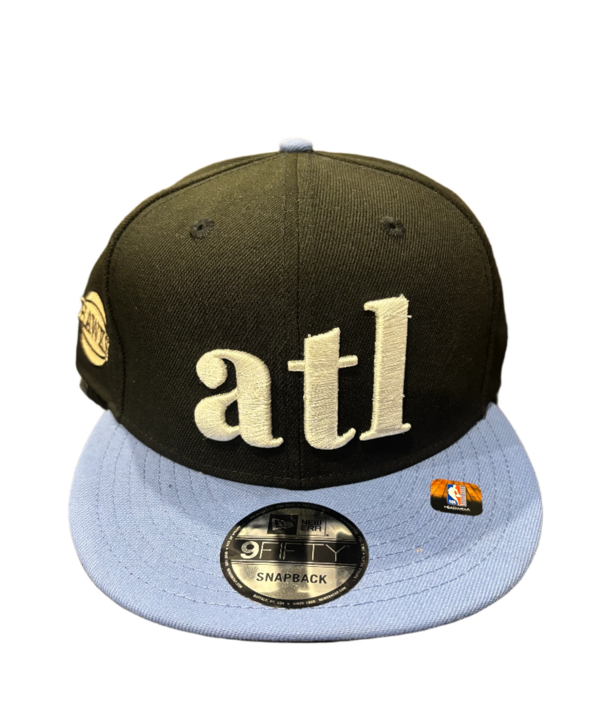 Black and blue cap with 'atl' 