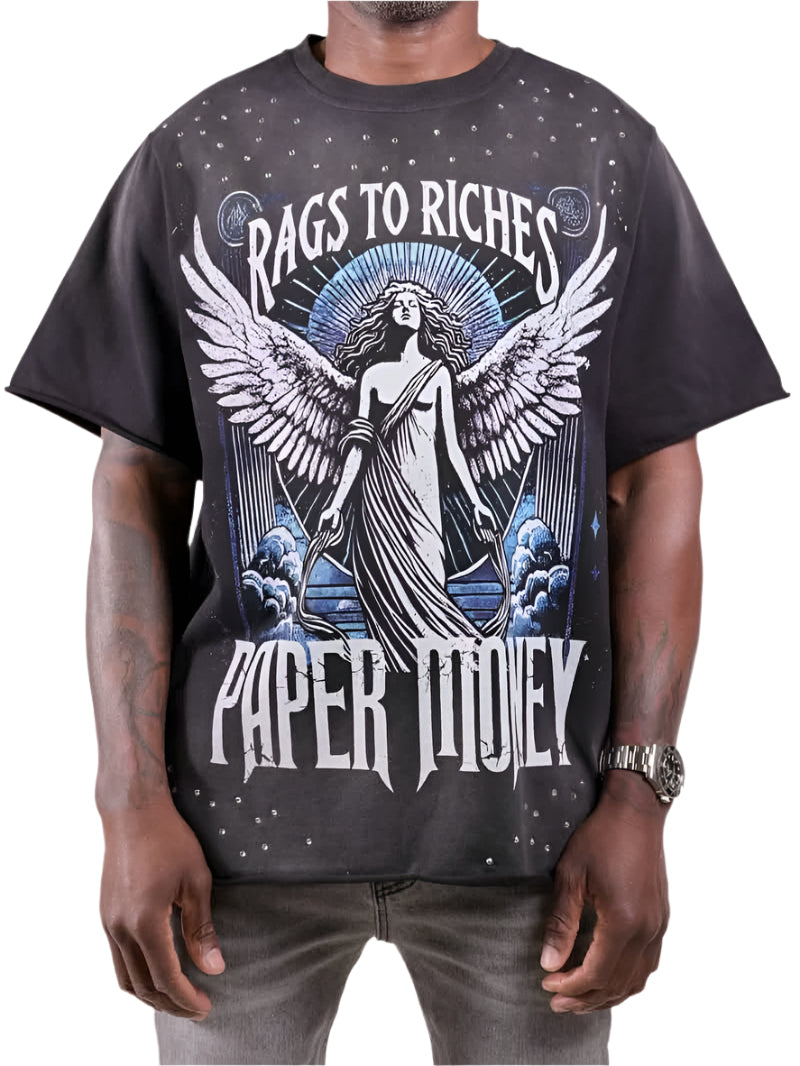 Person wearing a black t-shirt with 'Rags to Riches Paper Tidley' design featuring an angelic figure.
