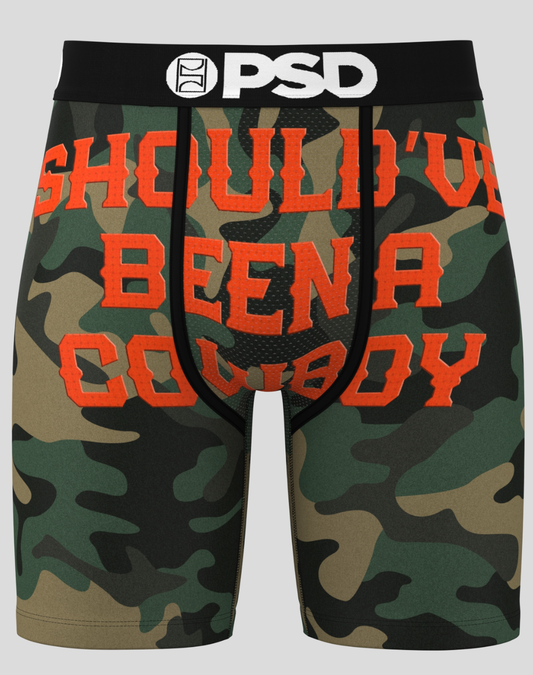 Camouflage boxer briefs with 'Should've Been a Cowboy' text and PSD logo.