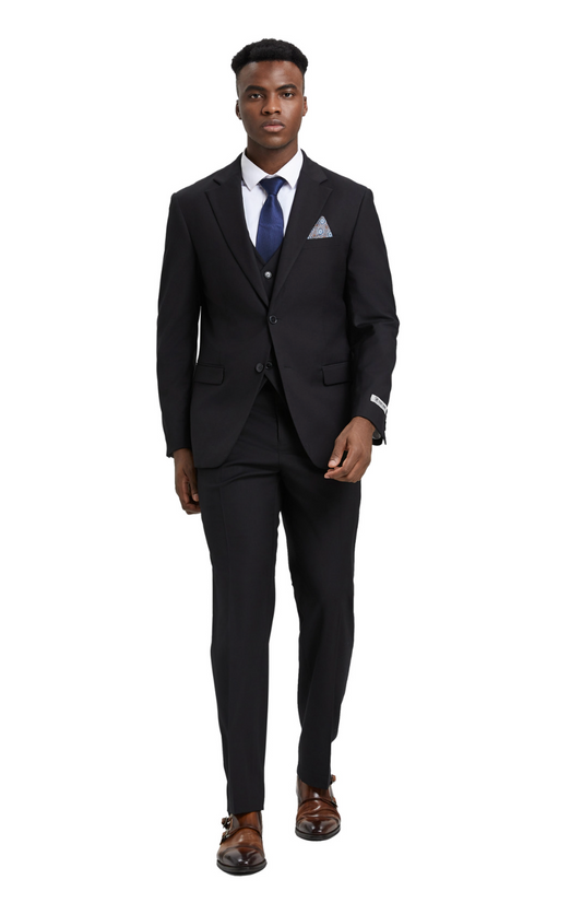 Man wearing a black suit with a blue tie on a white background