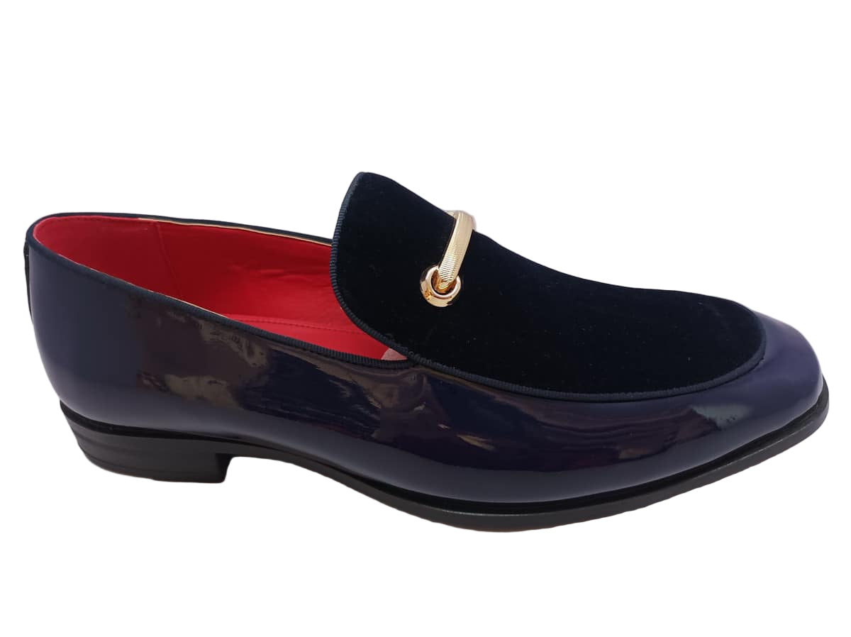 Navy loafer with gold buckle on a white background
