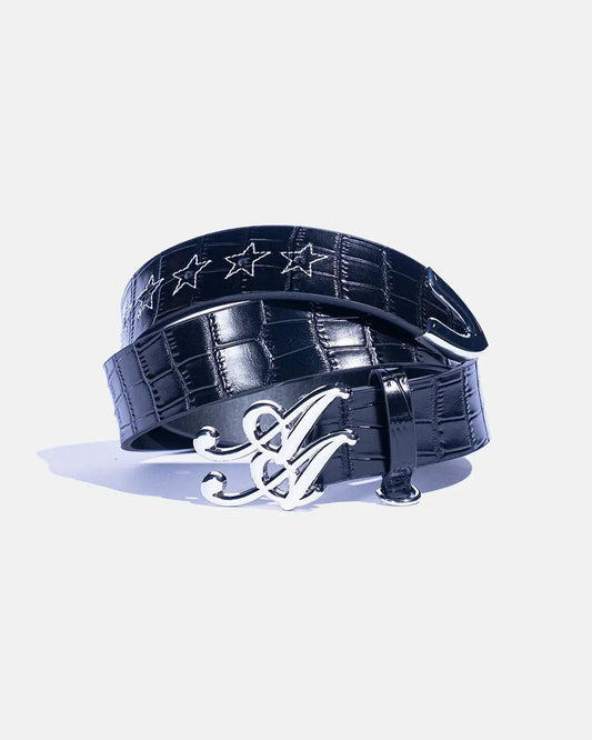 Ad Astra Caiman belt in black, coiled view with monogram buckle