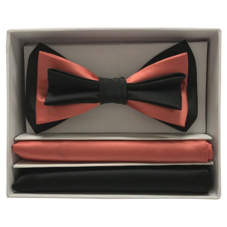 Coral and black bow tie with matching pocket square in a box on a white background