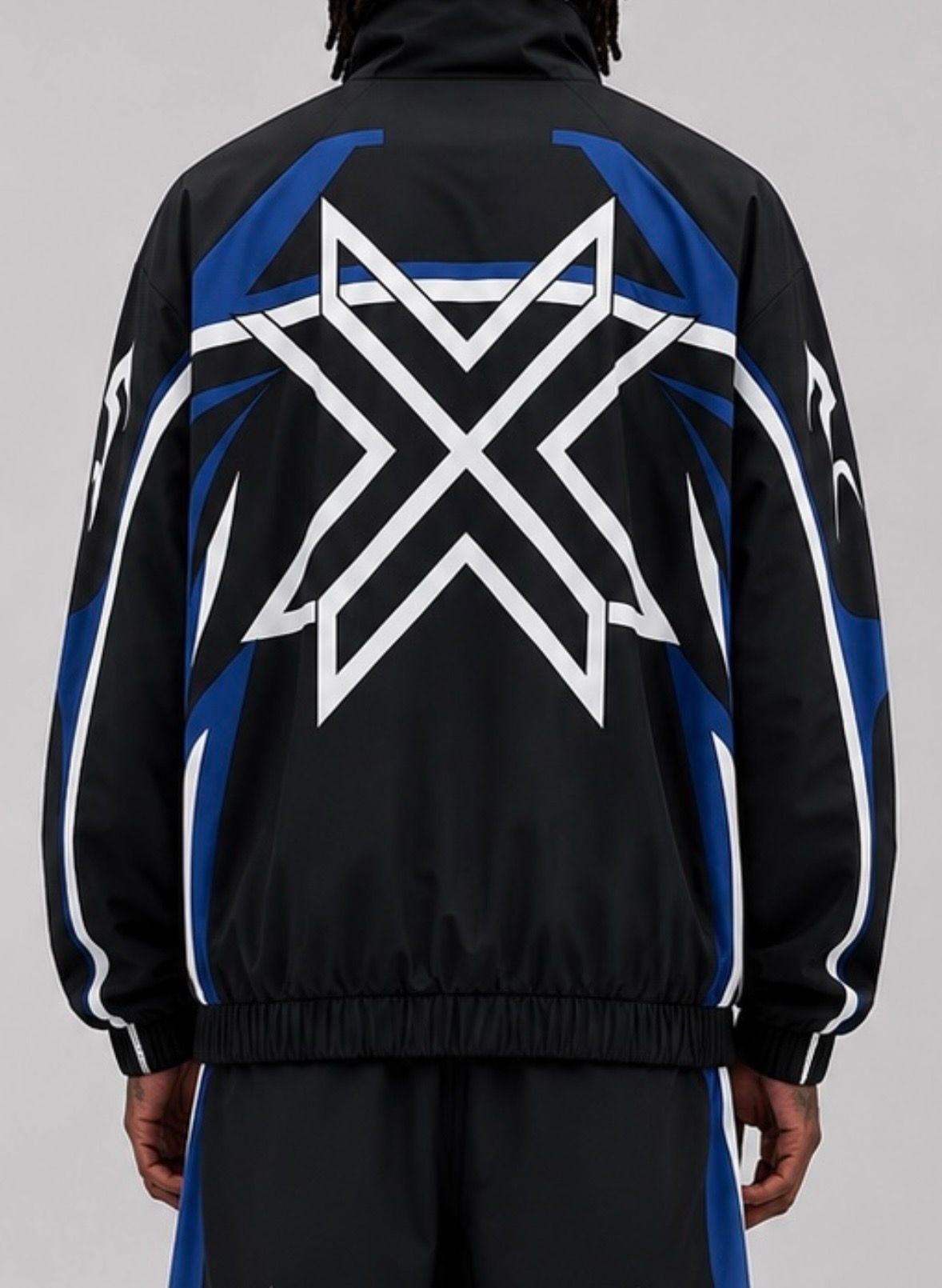 CRXSSCUT Velocity nylon jacket and pants set in black/blue, jacket back view