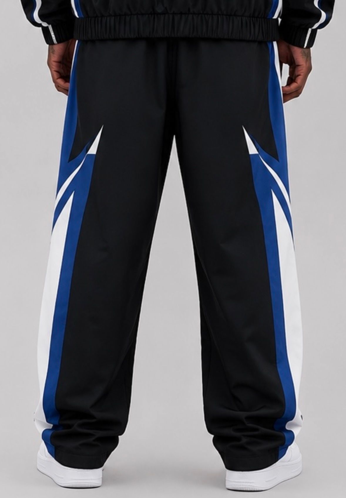 CRXSSCUT Velocity nylon jacket and pants set in black/blue, pants back view