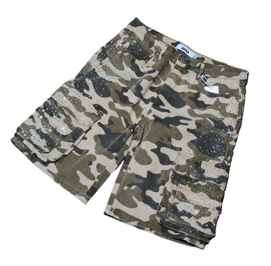 Camouflage shorts on a concrete floor