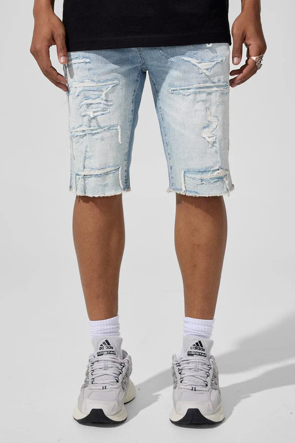 Jordan Craig J3226S Arlington denim shorts in Sky Blue with rip-and-repair details and frayed hems, front view on model