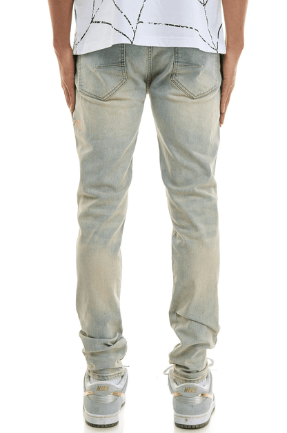 KDNK Dune Embroidered Skinny Jeans from On Time Fashions – Jeans by KDNK, Birmingham AL’s 1 fashion store and premier destination for streetwear, suits, kids fashion, and big & tall