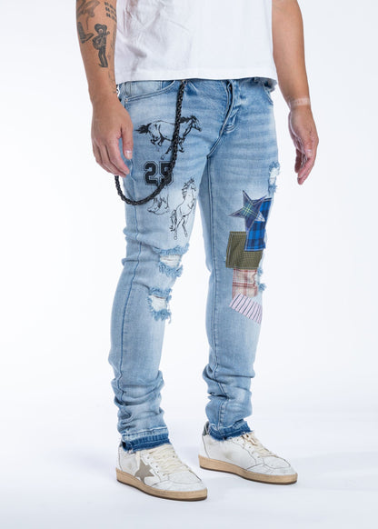 Midnight Black Stallions light blue jeans with horse graphics, angled view