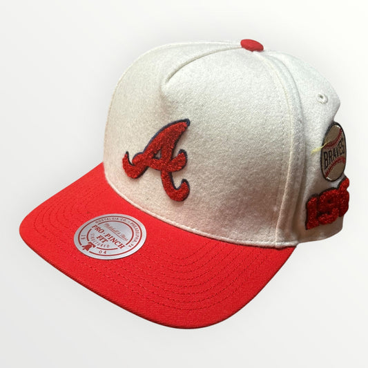 Mitchell & Ness Atlanta Braves Cream Team Pro Snapback from On Time Fashions – Snapback Hat by Mitchell & Ness, Birmingham AL’s 1 fashion store and premier destination for streetwear, suits, kids fashion, and big & tall
