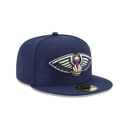 Angled front view of navy New Era 59Fifty New Orleans Pelicans cap with navy visor and team logo.
