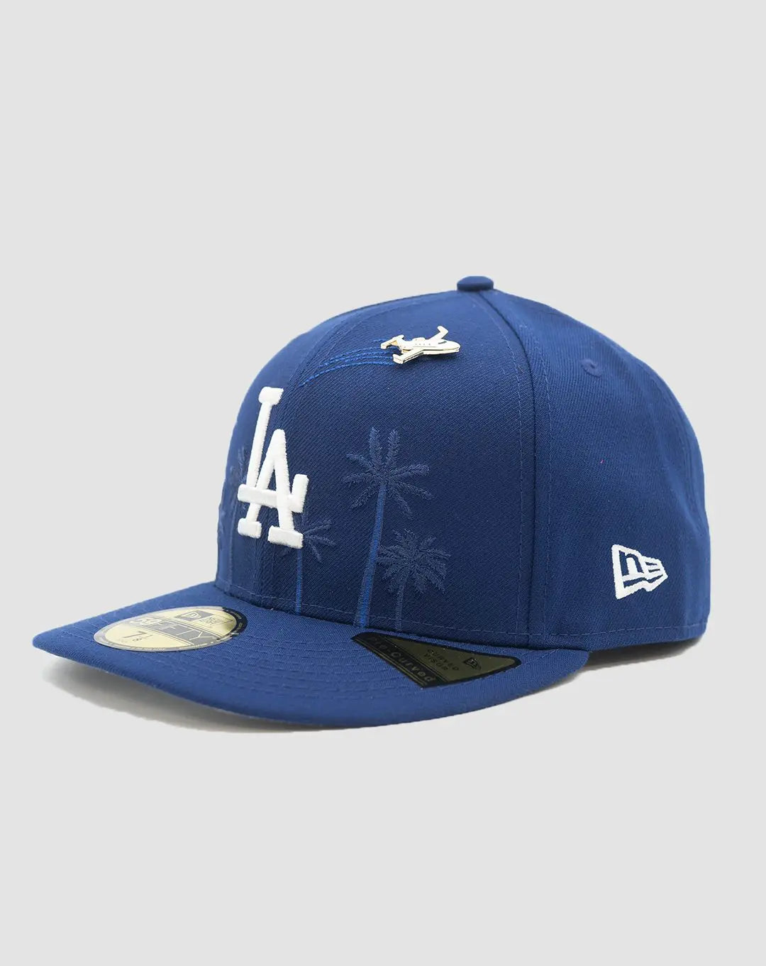 New Era Dodgers royal blue 59FIFTY fitted hat with palm embroidery and airplane pin, front angle