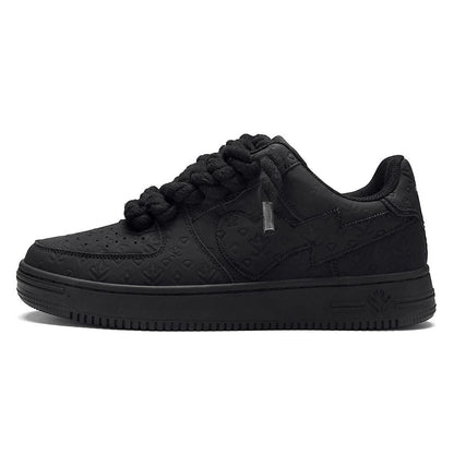 On Time Fashions black chunky sneakers with thick braided laces and embossed logo pattern.