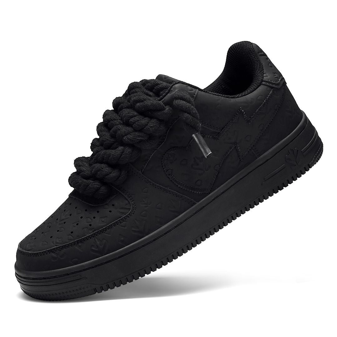 On Time Fashions black chunky sneakers with unique rope laces and embossed pattern.