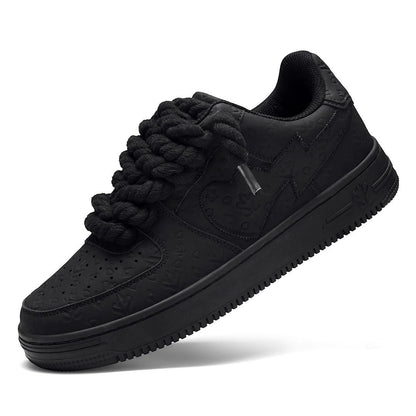 On Time Fashions black chunky sneakers with unique rope laces and embossed pattern.