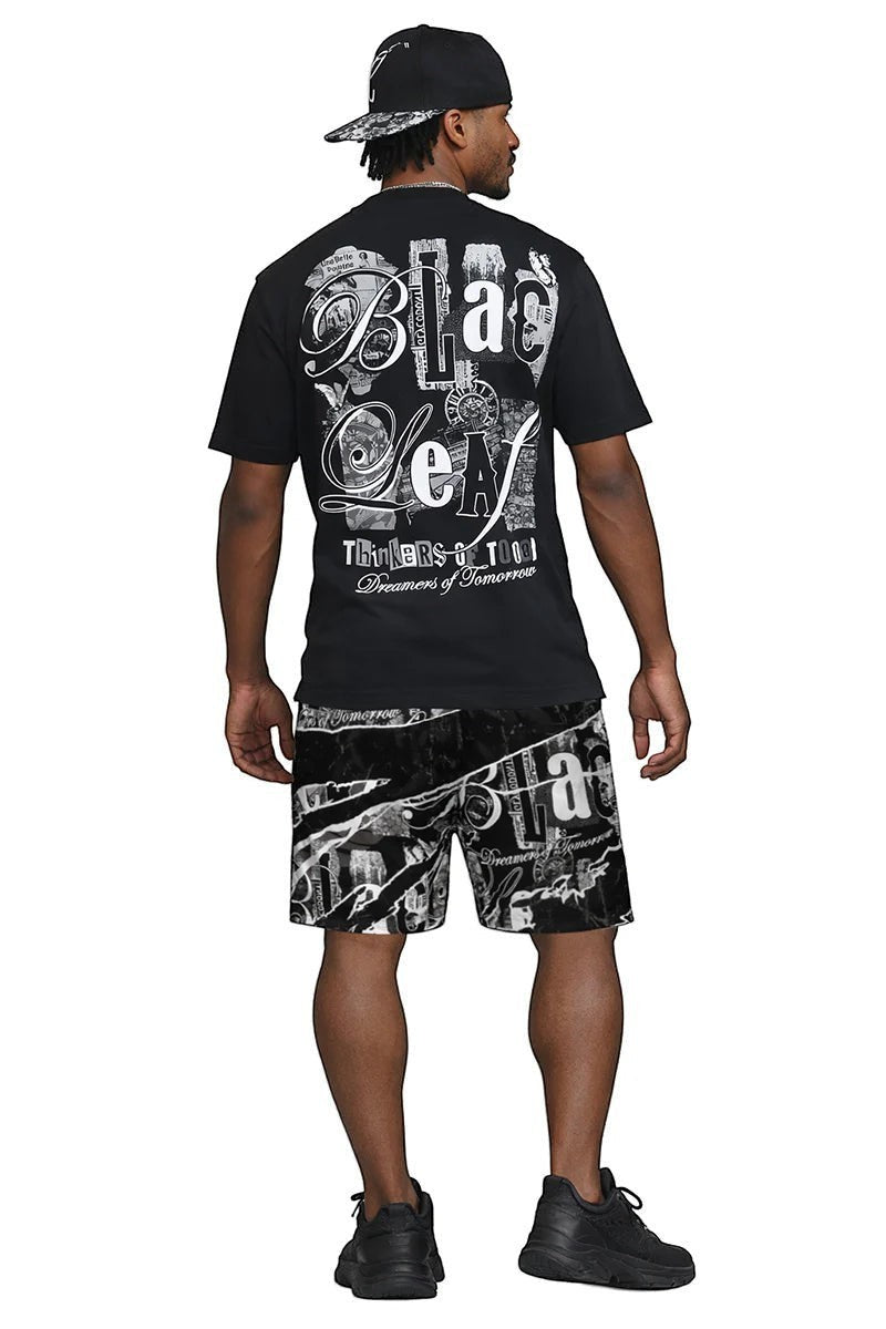On Time Fashions black cotton t-shirt with large graphic print on back, paired with matching shorts.