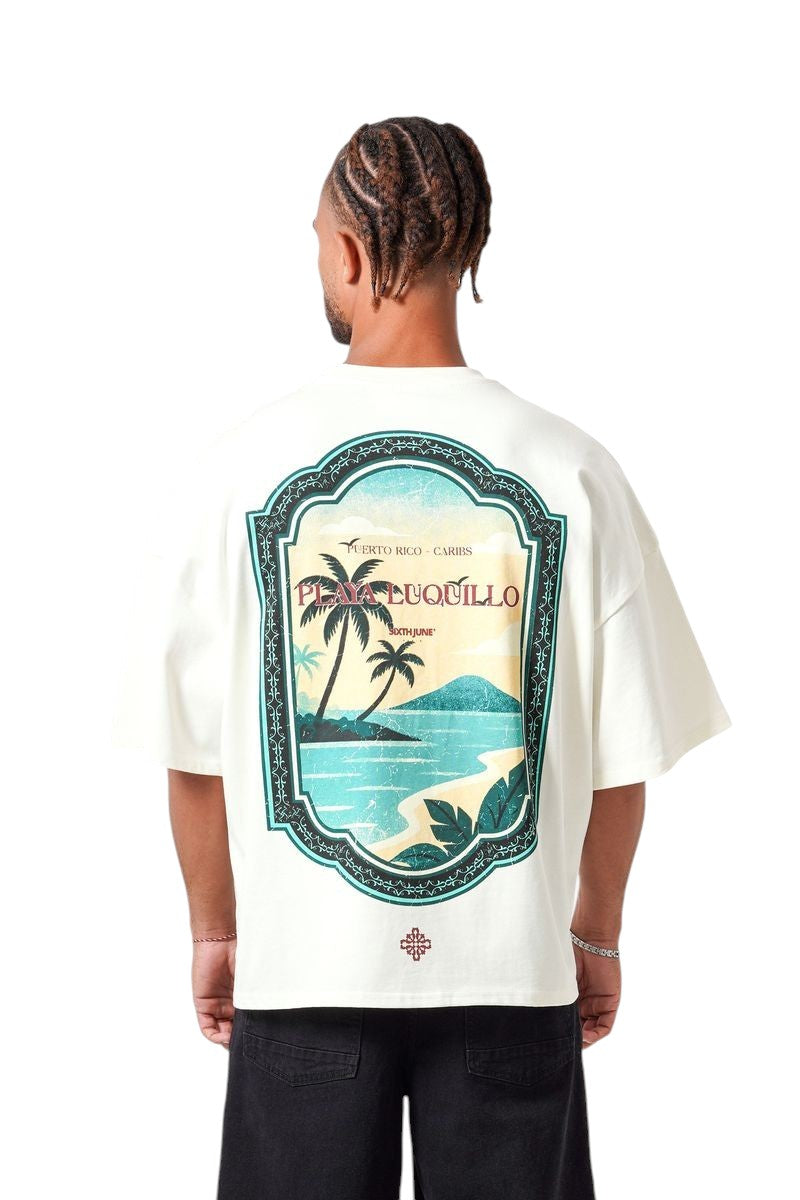 On Time Fashions cream oversized cotton tee with a vintage Caribbean beach print on the back.