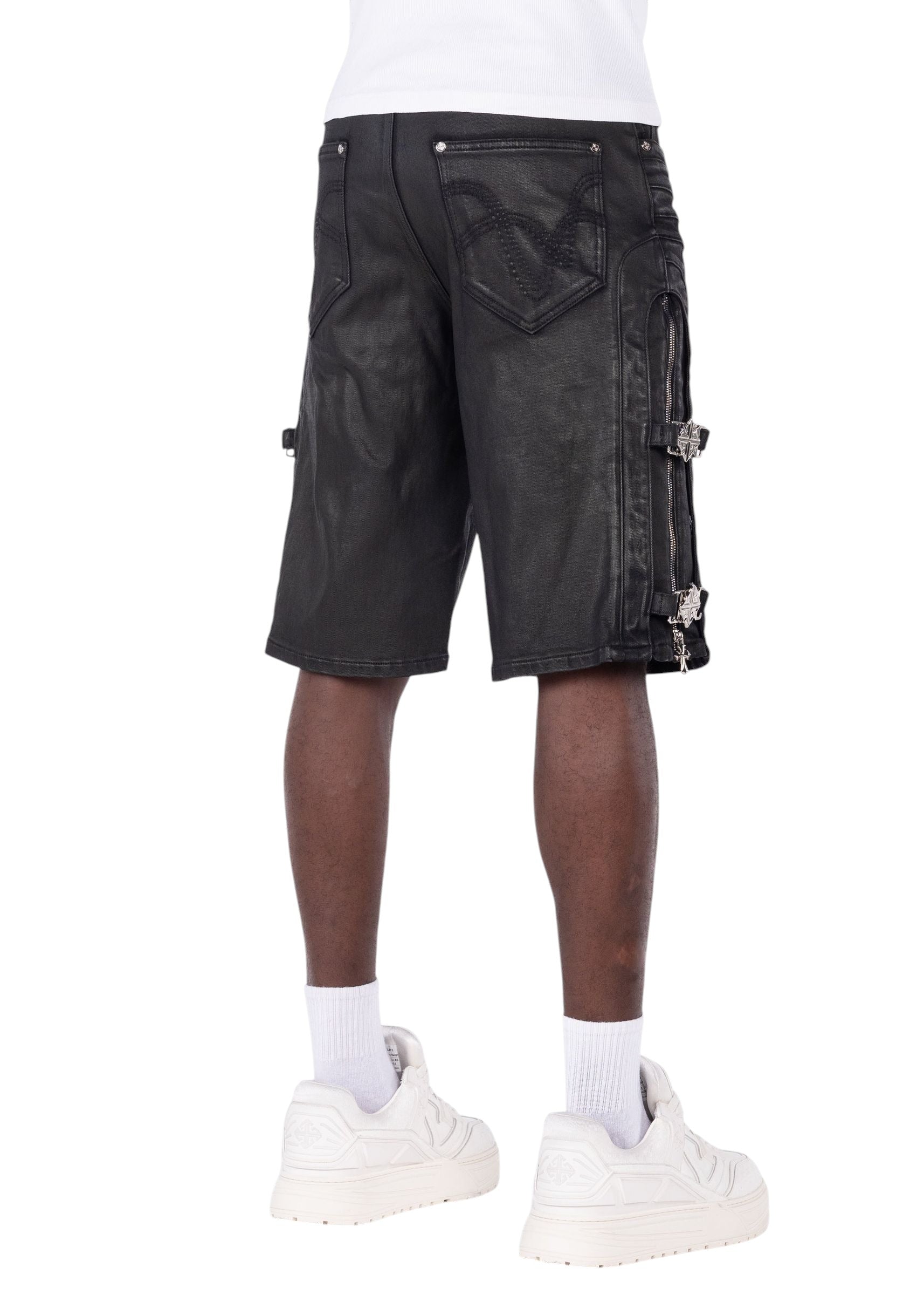 On Time Fashions Guapi all black denim shorts featuring cross buckle side straps and metal hardware, back view.