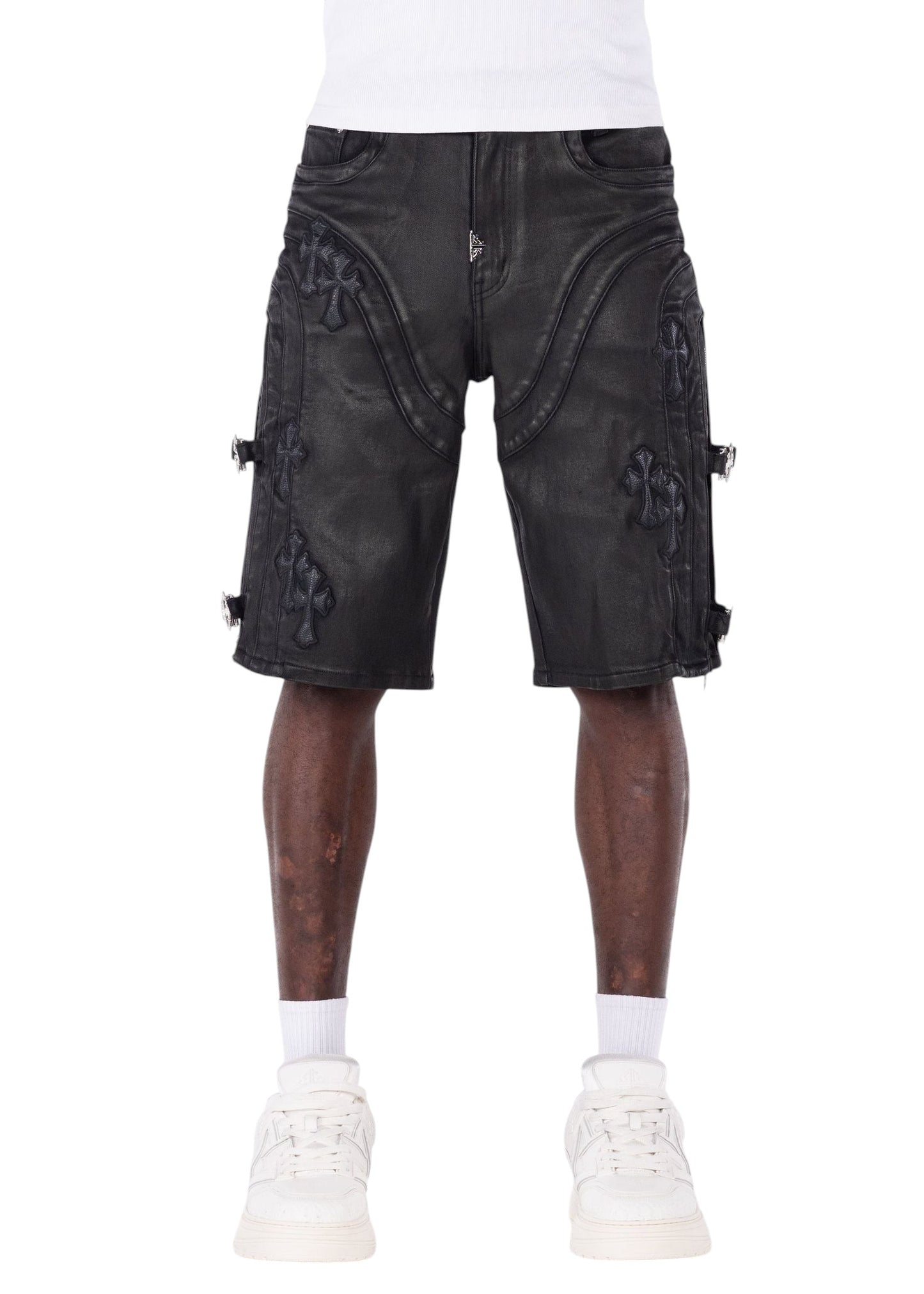 On Time Fashions Guapi all black denim shorts with cross appliqué, utility side straps, and metal hardware detailing.