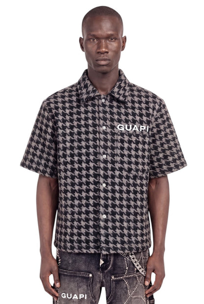 On Time Fashions Guapi black and gray houndstooth short-sleeve faux-fur shirt with chest logo on a male model