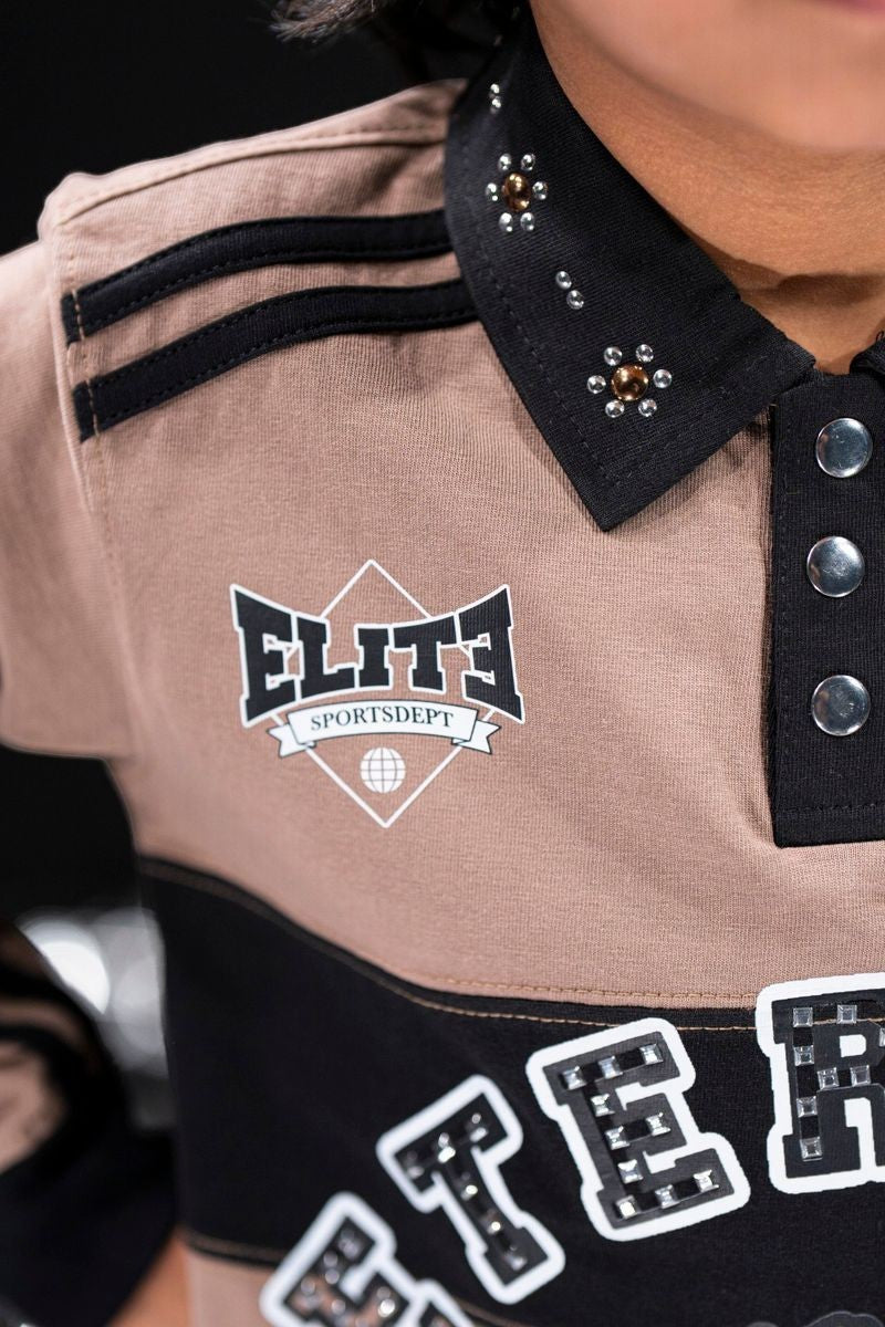 On Time Fashions kid's tan and black polo shirt with rhinestone and pearl collar details, black stripes on shoulder, and embellished lettering.