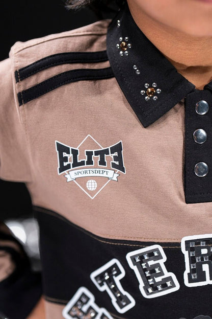 On Time Fashions kid's tan and black polo shirt with rhinestone and pearl collar details, black stripes on shoulder, and embellished lettering.