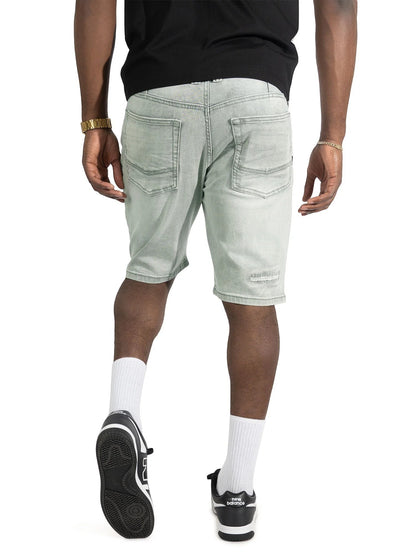 On Time Fashions Makobi Prego light gray denim shorts with distressed details. Model wears shorts with white socks and black sneakers.