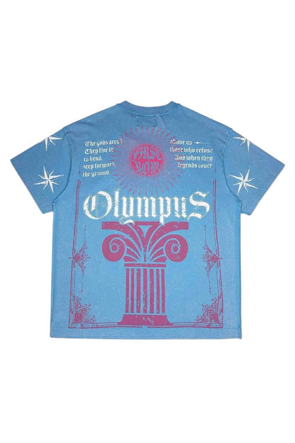 On Time Fashions blue washed graphic tee featuring Olympus column print, text, and star motifs in pink and white.