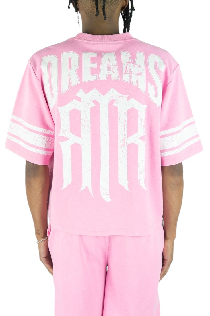 On Time Fashions pink jersey with white 'DREAMS' and 'RMR' graphic print, featuring striped sleeves.