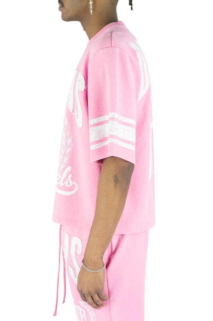 On Time Fashions pink jersey with white distressed patches and sleeve stripes. Features "Rebel Minds" graphic.