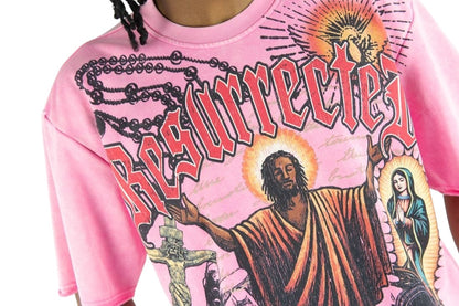 On Time Fashions pink heavyweight French terry t-shirt with Resurrected graphic print and religious iconography.