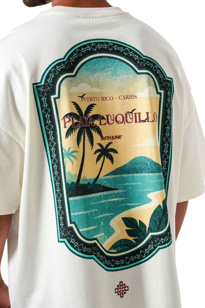On Time Fashions cream oversized cotton tee with a vintage Caribbean beach graphic on the back.