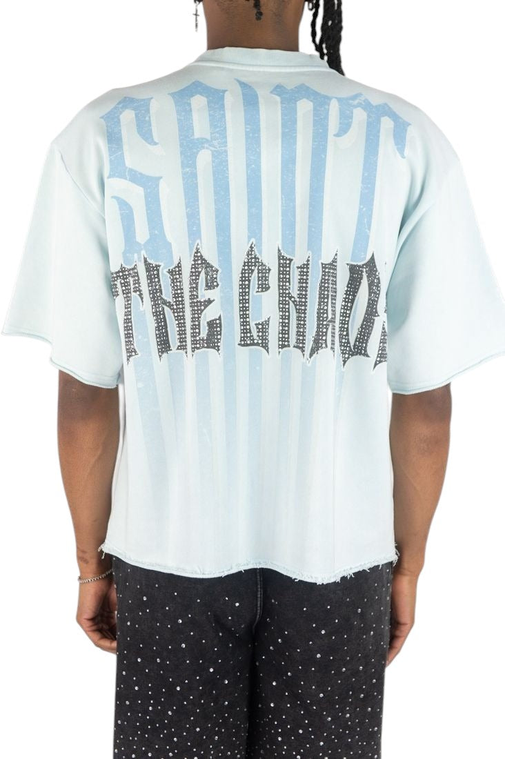 On Time Fashions light blue Rebel Minds crop tee with back graphic print, raw hem, and boxy streetwear fit.