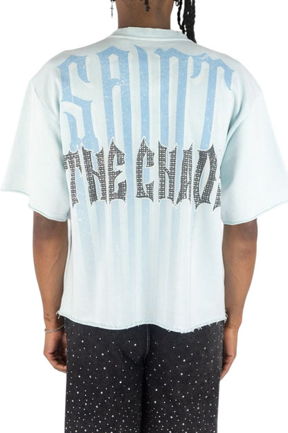 On Time Fashions light blue Rebel Minds crop tee with back graphic print, raw hem, and boxy streetwear fit.