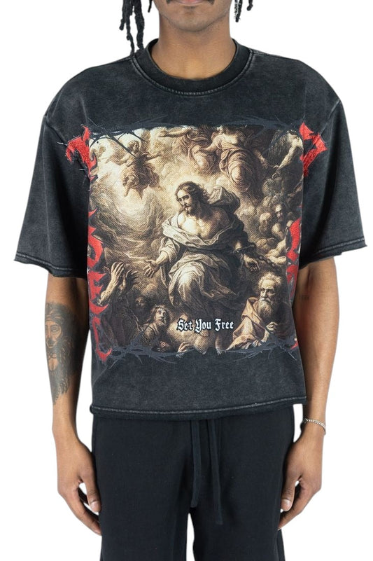 On Time Fashions heavyweight black French terry tee featuring a bold religious graphic print and Set You Free text.