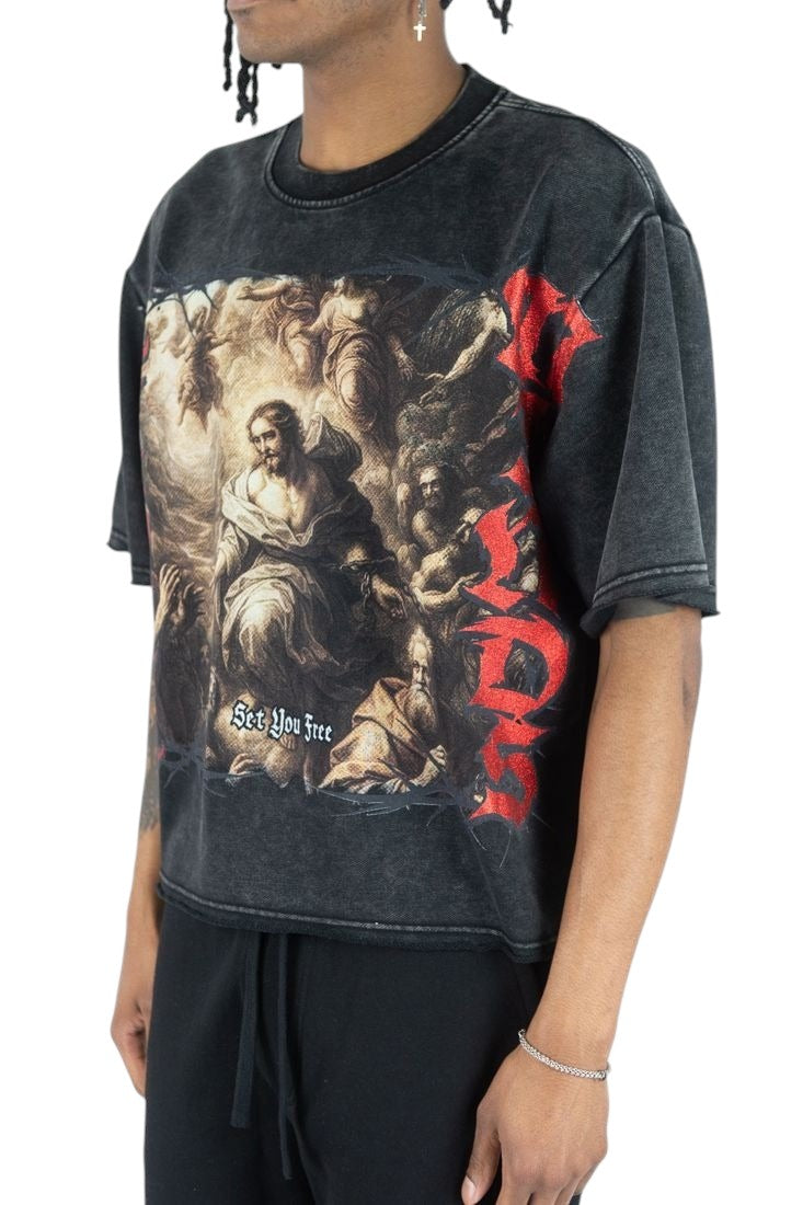 On Time Fashions heavyweight black acid-wash tee with Set You Free graphic print and red text on a male model.