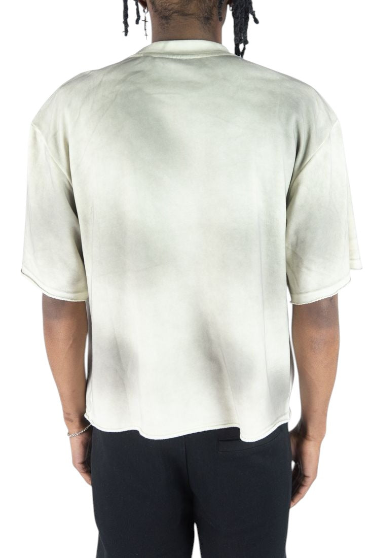 Model wearing On Time Fashions Rebel Minds Jesus Relic heavyweight French terry tee in a faded grey wash.