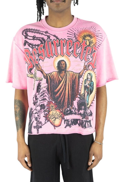 On Time Fashions pink heavyweight French terry tee featuring a graphic print of Jesus and religious iconography.