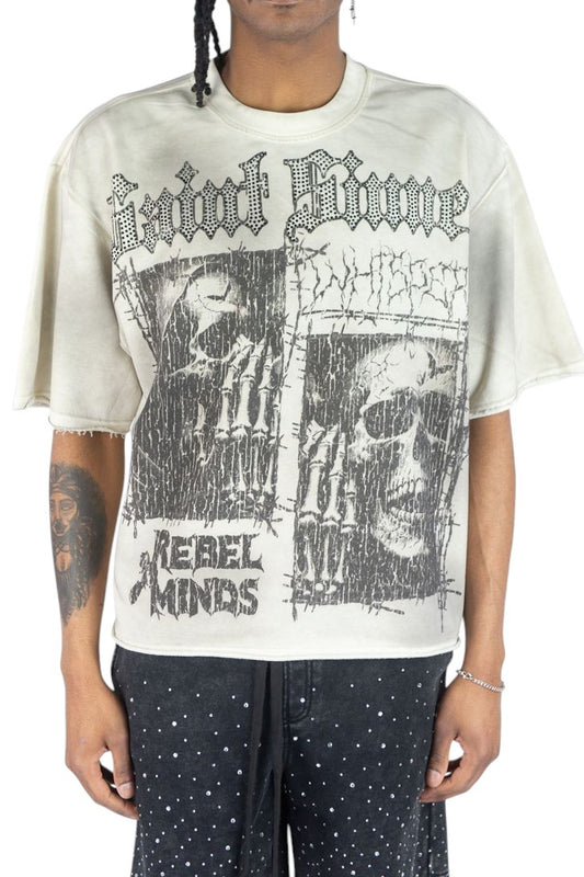 On Time Fashions Rebel Minds Whispers heavyweight cream crop tee with graphic skull print and raw hem detail.