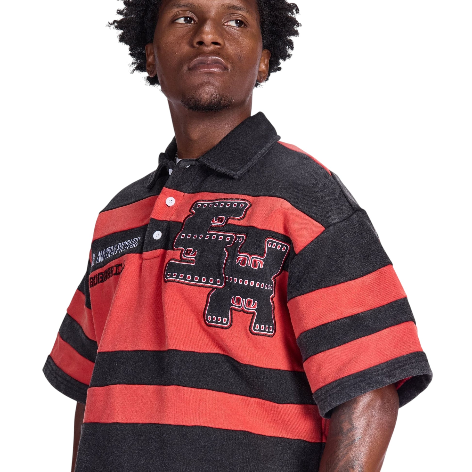 On Time Fashions red and black striped short-sleeve polo shirt with graphic chest detail and button collar.